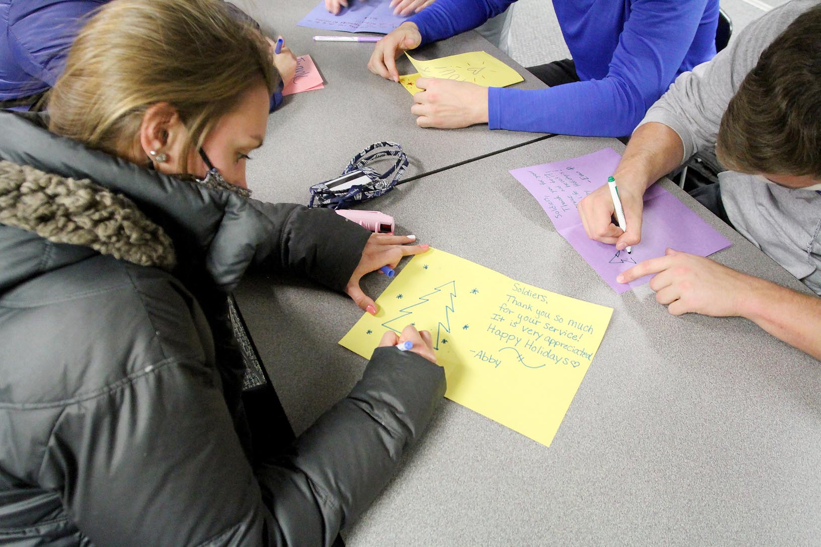 UNK student Abby Everitt of O’Neill creates a holiday card for a U.S. military member Tuesday evening during the Sisters for Soldiers event hosted by the Alpha Omicron Pi sorority.