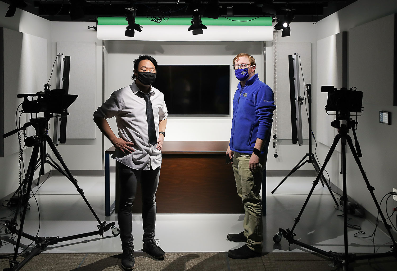 UNK junior Ryan Range, left, and associate communication professor Jacob Rosdail are pictured in the video studio inside Mitchell Center on campus. Range produced his documentary, “When The World Closed,” while working with Rosdail through UNK’s Summer Student Research Program.