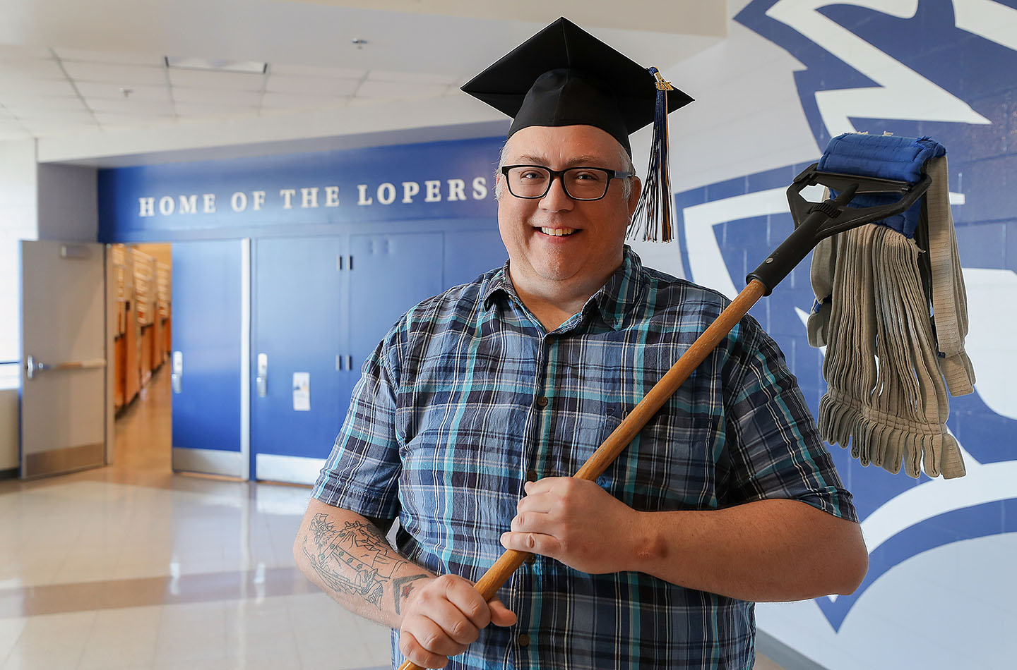 Sonny O’Connor worked as a custodian while attending UNK and used the university’s employee scholarship program to cover tuition costs. He’ll graduate Friday with a bachelor’s degree in general studies. (Photo by Erika Pritchard, UNK Communications)