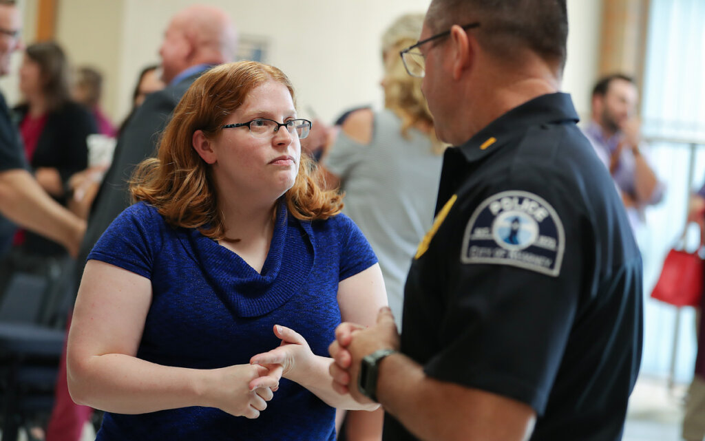 UNK associate criminal justice professor Timbre Wulf, left, chats with Kearney Police Lt. Kevin Thompson during Friday's event.