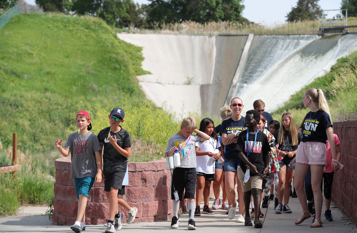 Students attending the PAWS University Prep Academy visit the Kearney Canal spillway on the UNK campus while learning about water.