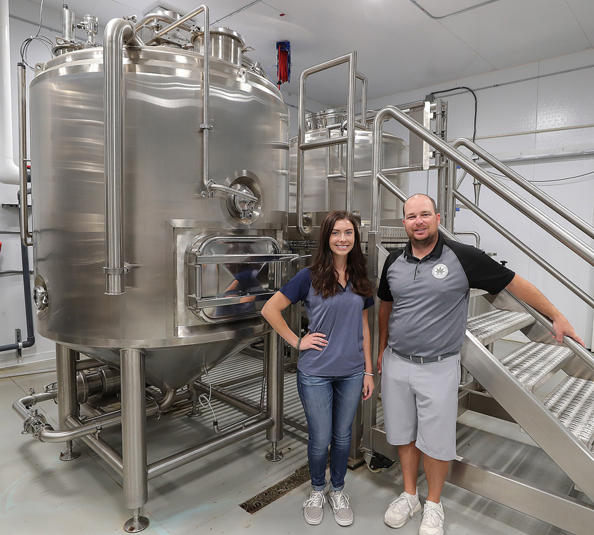 Madi Levander, left, is pictured with Brett Mayo, chief marketing and extraction officer at Sweetwater Hemp Company.