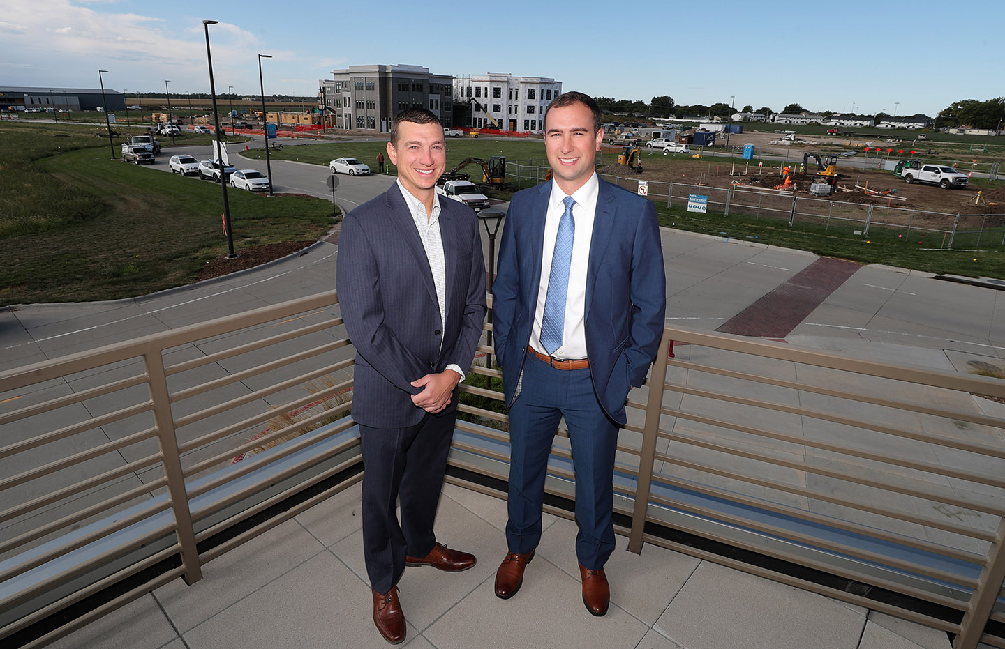Joey Cochran, left, and Michael Christen are pictured at UNK’s University Village development. Cochran is a member of the University Village board and Christen serves as executive director.