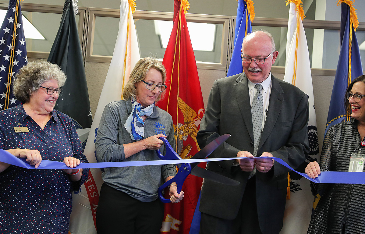 From left, UNK Military and Veterans Services Assistant Director Lori Skarka, Vice Chancellor for Enrollment Management and Marketing Kelly Bartling and Senior Vice Chancellor for Academic and Student Affairs Charlie Bicak participate in Thursday’s ribbon-cutting for the new Military and Veteran Student Center on campus. (Photos by Erika Pritchard, UNK Communications)