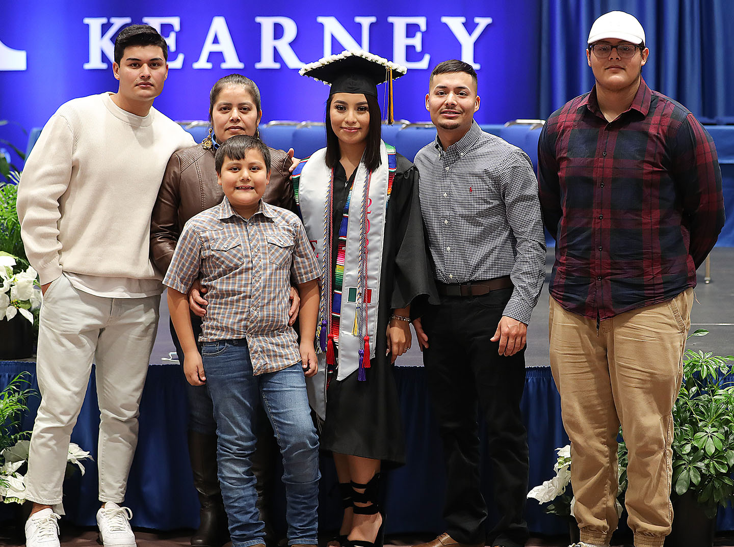 Jazmin Urbina poses for a photo with her family following Friday’s winter commencement ceremony at UNK. She earned a bachelor’s degree in elementary education with an English as a second language endorsement. (Photo by Erika Pritchard, UNK Communications) 