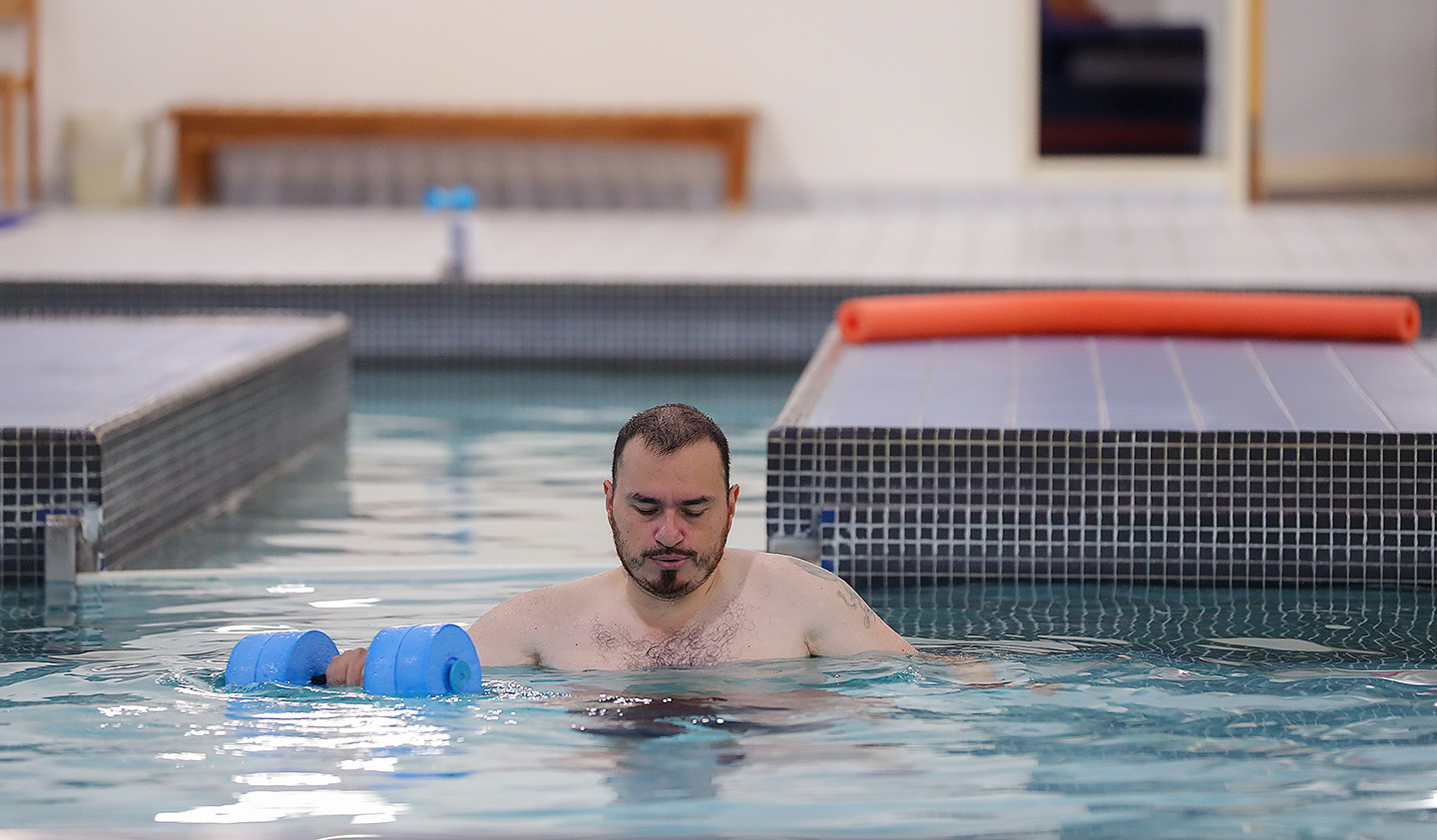 John Rodriguez continues to recover from a stroke he suffered four years ago. The 43-year-old Kearney resident works out in the pool at CHI Health Good Samaritan and receives additional support through the Creating Connections program launched earlier this year. (Photos by Erika Pritchard, UNK Communications)