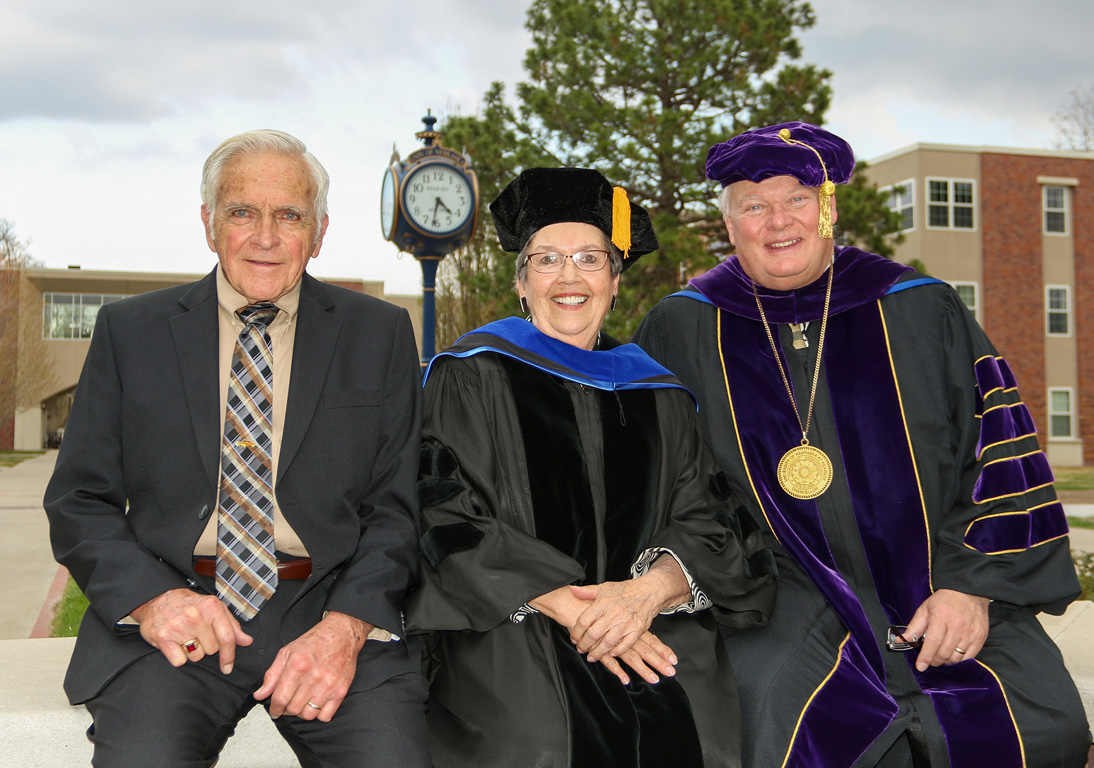 From left, Keith and Eileen Carpenter pose for a photo with UNK Chancellor Doug Kristensen. The Carpenters recently donated the campus clock pictured in the background.