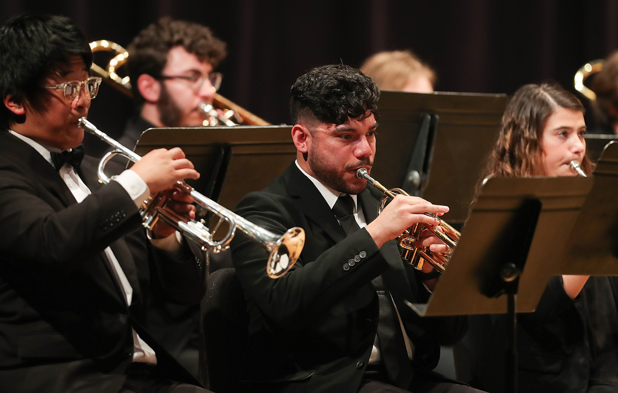 Giovanni Flores, center, plays the trumpet during the UNK Wind Ensemble spring concert in April.