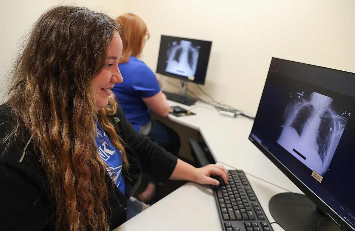 UNK senior Johanna McClure is one of 10 students who participated in the Summer Student Research Program. Working with assistant psychology professor Katherine Moen, she’s studying search patterns to identify the most effective ways to read X-rays. (Photos by Erika Pritchard, UNK Communications)