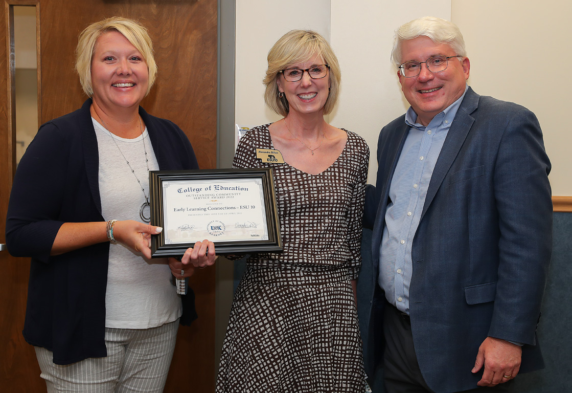 From left, ESU 10 Early Learning Connection coach consultant Amy Sjoholm and coordinator Alexandra Dillon are pictured with UNK College of Education Dean Mark Reid during Monday’s board meeting in Kearney. Sjoholm and Dillon received the College of Education’s “Making a Difference” Outstanding Community Service Award. (Photos by Erika Pritchard, UNK Communications)