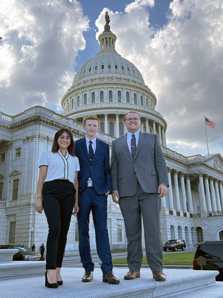 From left, UNK students Arlen Gutierrez, Tanner Butler, and Braden Peterworth pose for a photo at the US Capitol in Washington, DC.  (photo courtesy)