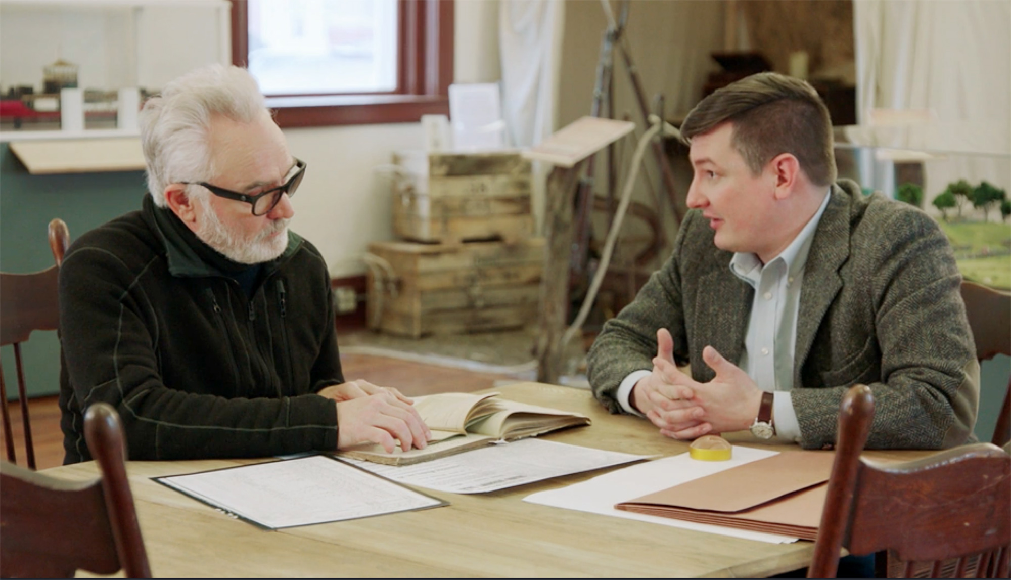 Actor Bradley Whitford, left, and UNK assistant history professor Nathan Tye discuss Whitford’s family connection to Nebraska during a recent episode of the NBC show “Who Do You Think You Are?”