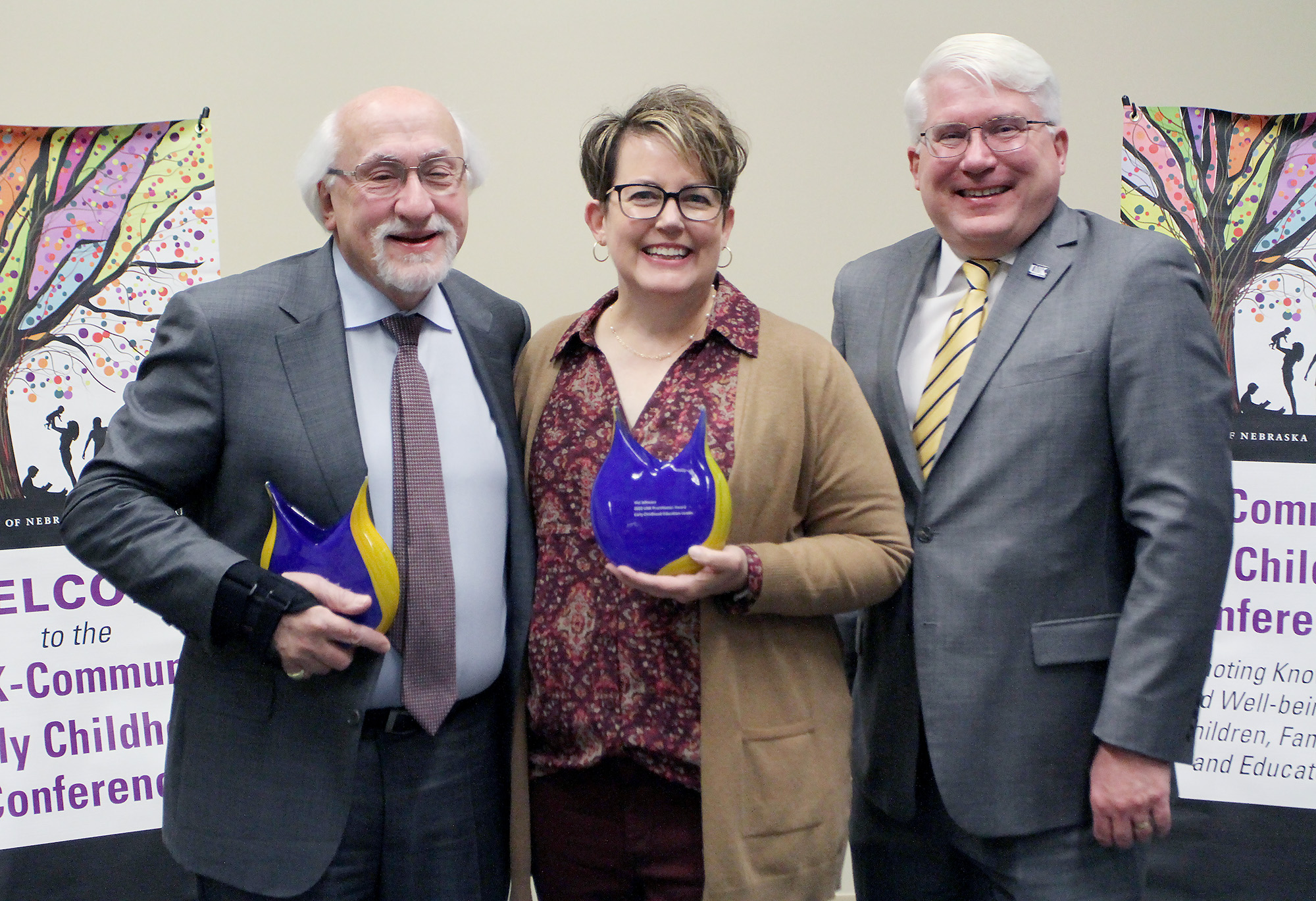 UNK College of Education Dean Mark Reid, right, is pictured with award recipients Samuel Meisels and Nici Johnson during Friday’s UNK-Community Early Childhood Conference.