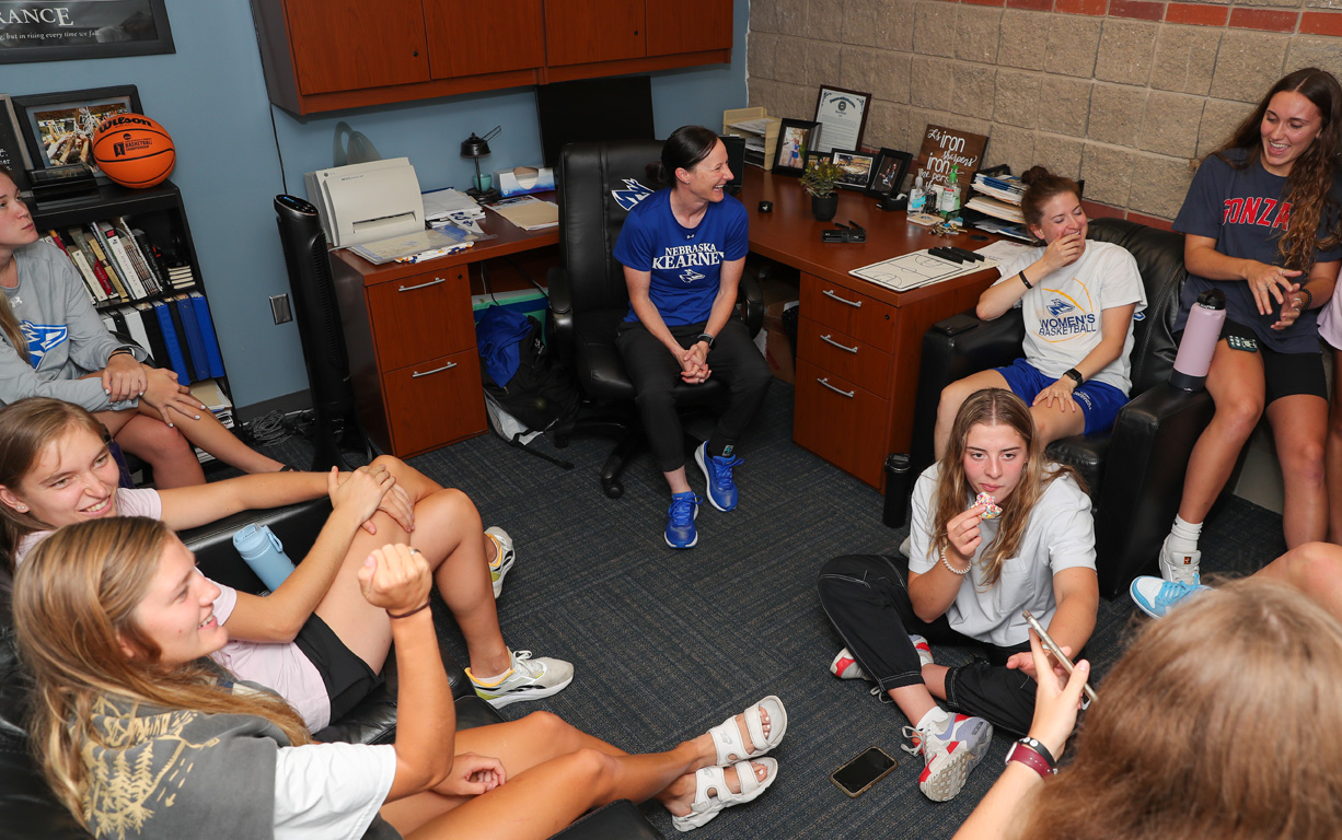 UNK head women’s basketball coach Carrie Eighmey uses a team approach to address health and wellness. Her players support and learn from each other.