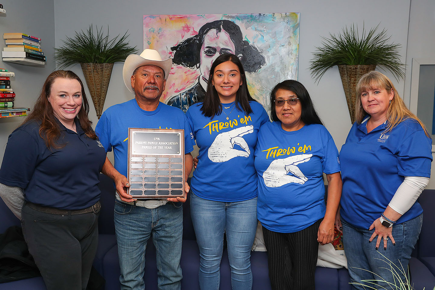 Juana Perez and her parents Lorenzo and Flora pose for a photo with UNK Office of Student and Family Transitions Assistant Director Kelly Tuttle Krahling, left, and UNK Parent and Family Association Chairperson Terri Lovitt, right. The Perez family was recognized as the UNK Family of the Year. (Photo by Erika Pritchard, UNK Communications)