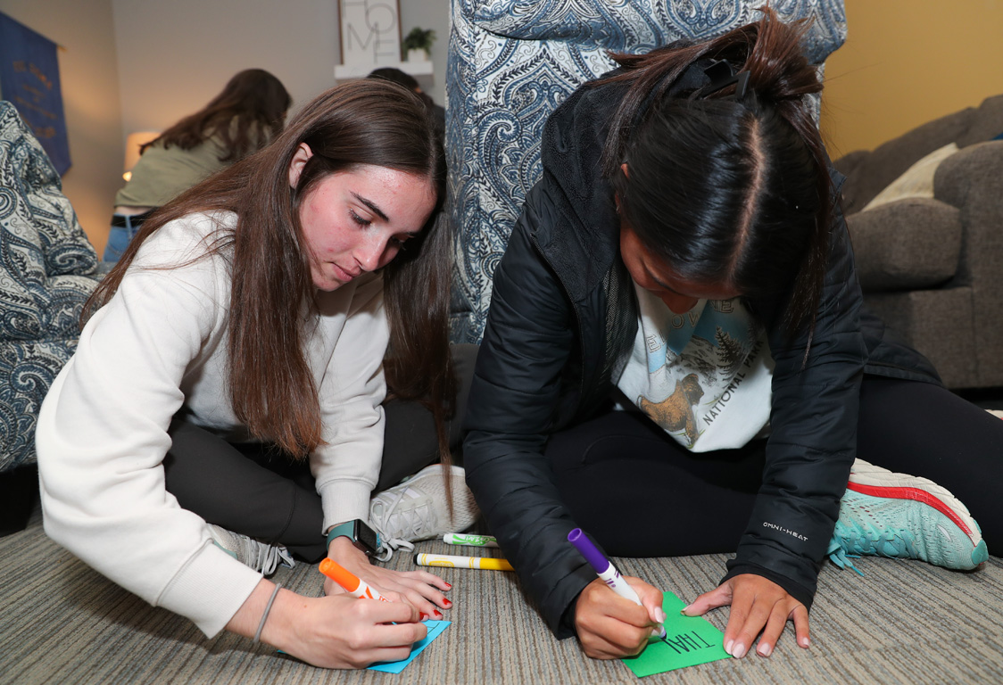UNK students create Christmas cards for U.S. military members Thursday evening during the Sisters for Soldiers event.