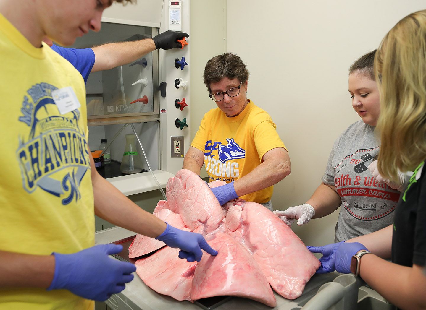UNK biology professor Janet Steele uses cooling to teach students about the respiratory system during a Health Science Explorers summer camp.