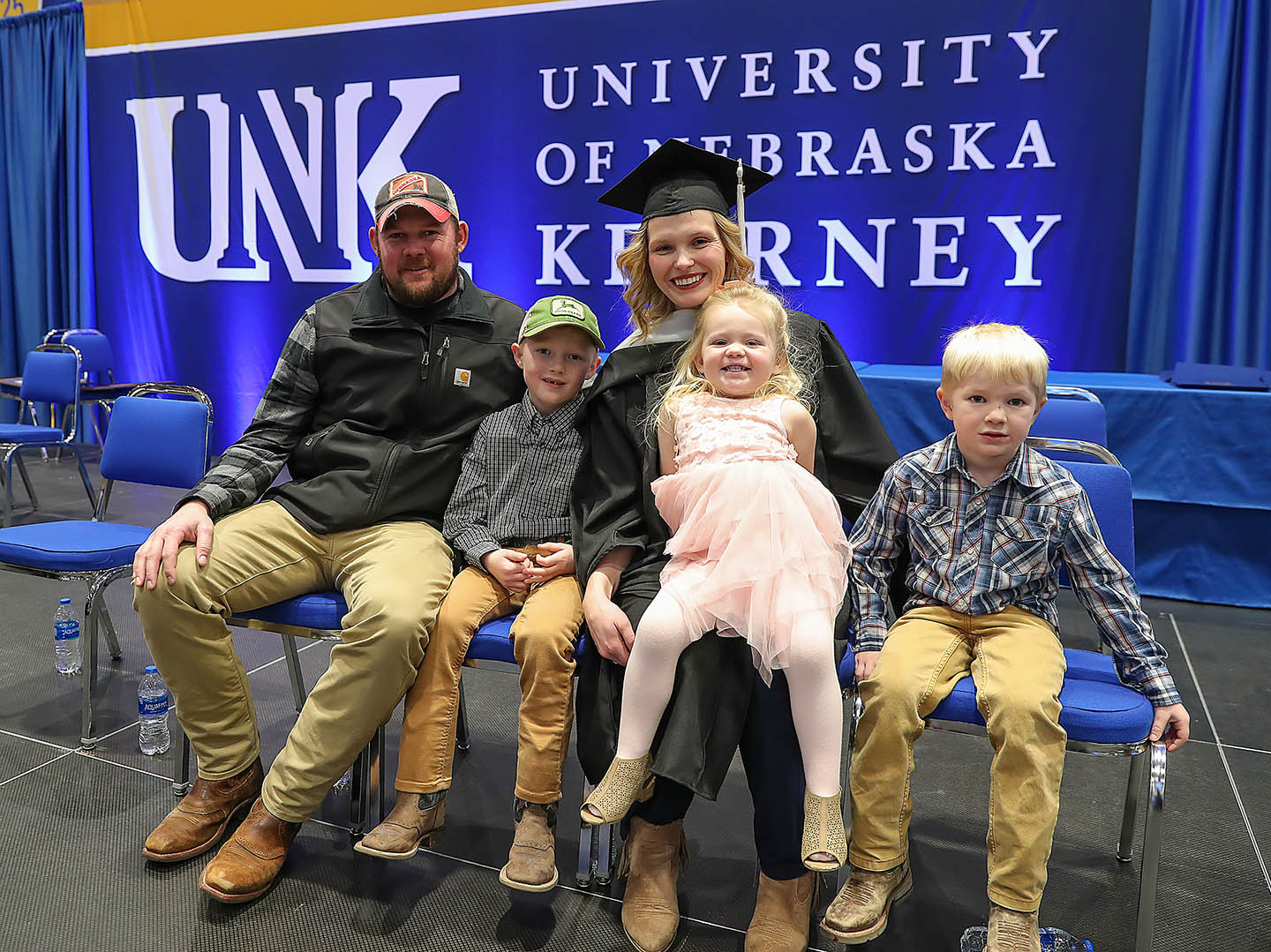 Nicole Strope is pictured with her husband Shane and their children Boe, Lea and Coy following Friday’s winter commencement ceremony at UNK. (Photo by Erika Pritchard, UNK Communications)