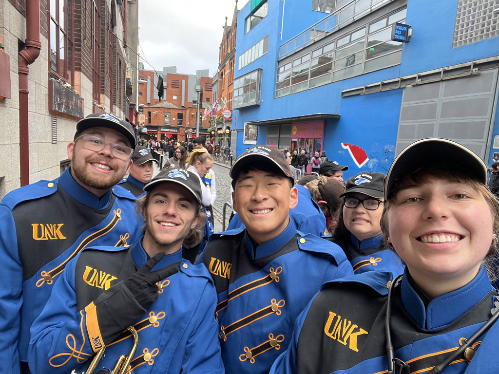 Emma Schroeder, right, and other members of the UNK Pride of the Plains Marching Band pose for a photo during their recent trip to Ireland. (Courtesy photos)