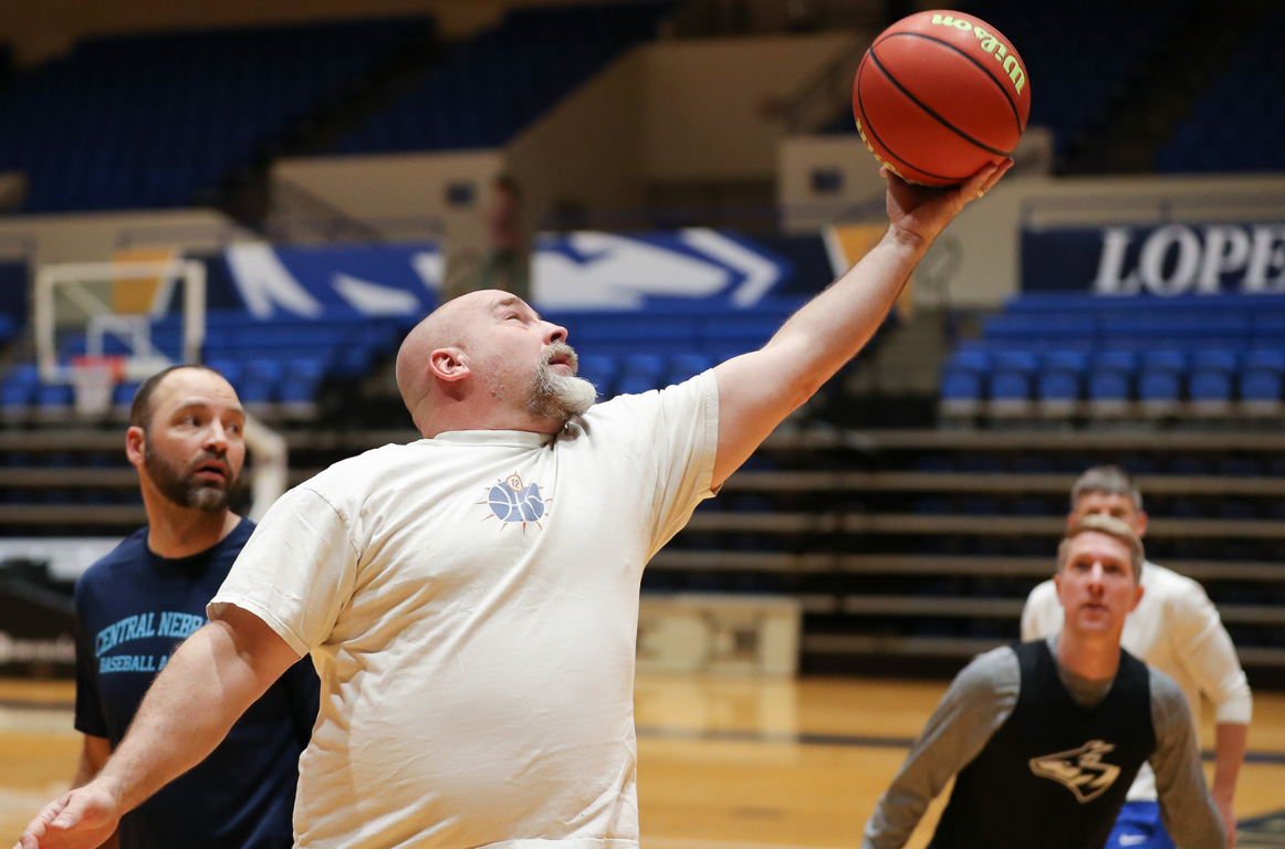 Rick Schuessler has been playing noon ball at UNK since 1995. The 56-year-old professor of art and design still laces up his sneakers once a week. (Photos by Erika Pritchard, UNK Communications)