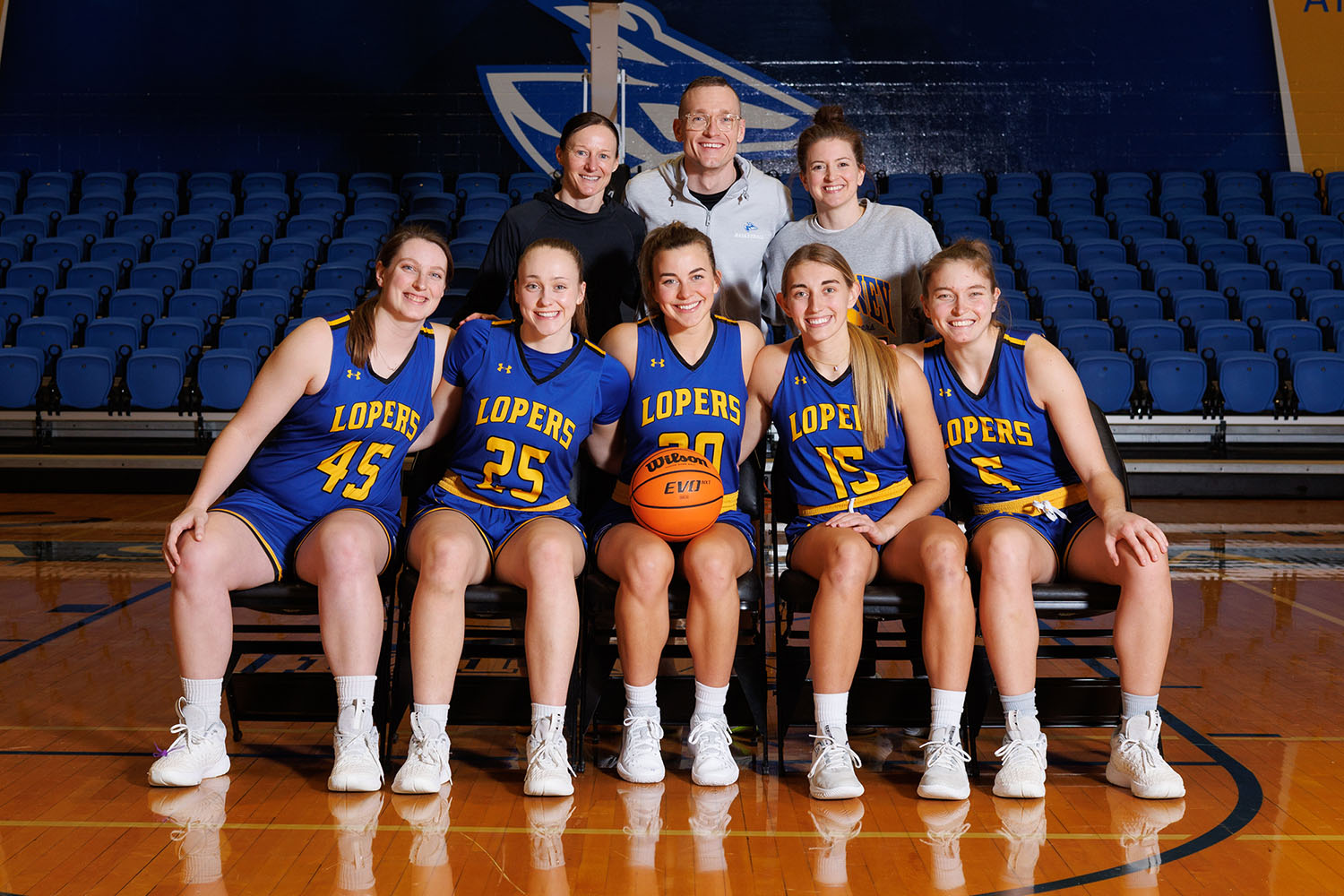 UNK women’s basketball players, front row from left, Brooke Carlson, Shiloh McCool, Klaire Kirsch, Maegan Holt and Elisa Backes are pictured with coaches, back row from left, Carrie Eighmey, Devin Eighmey and Bailey Morris.