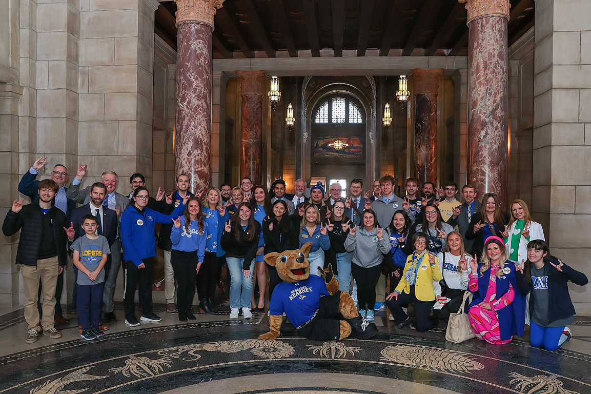 Sen. John Lowe of Kearney poses for a photo with UNK students, staff, faculty and administrators Wednesday during “I Love NU” Day at the State Capitol.