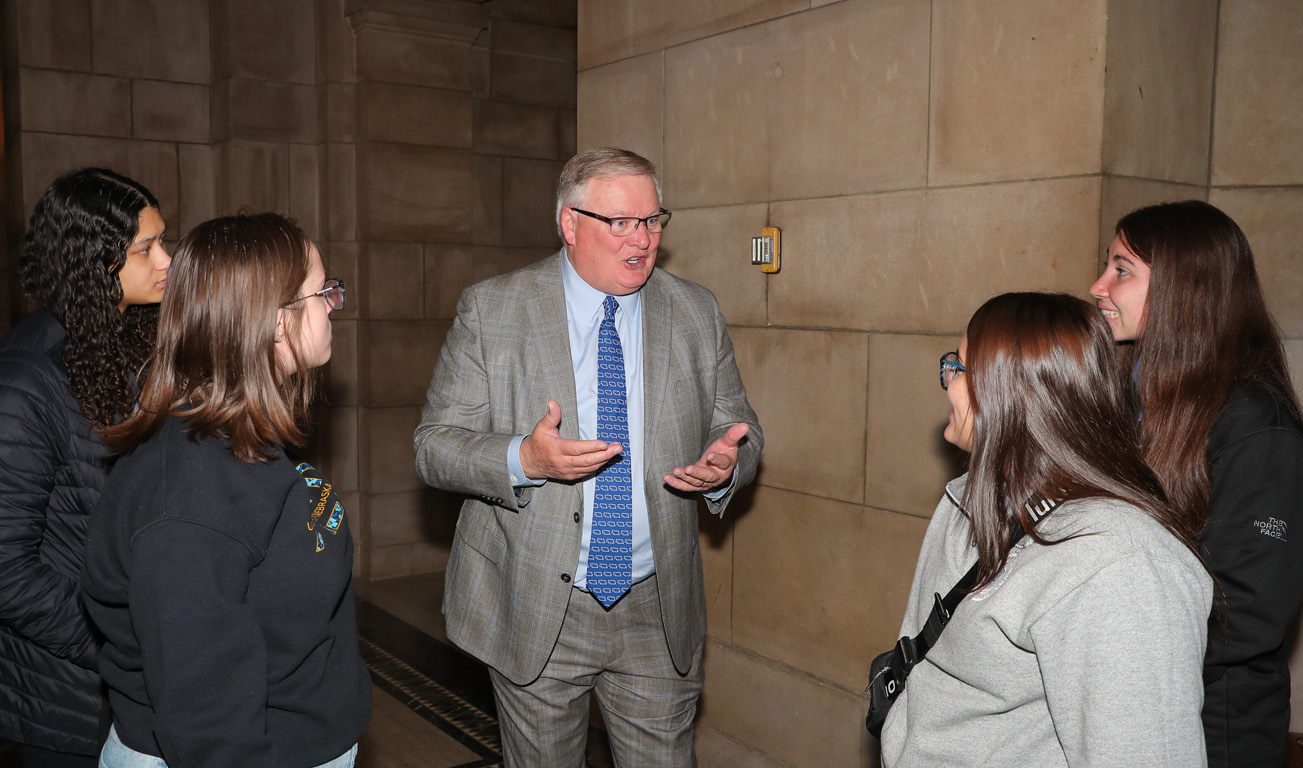 UNK Chancellor Doug Kristensen talks to students attending “I Love NU” Day at the State Capitol.