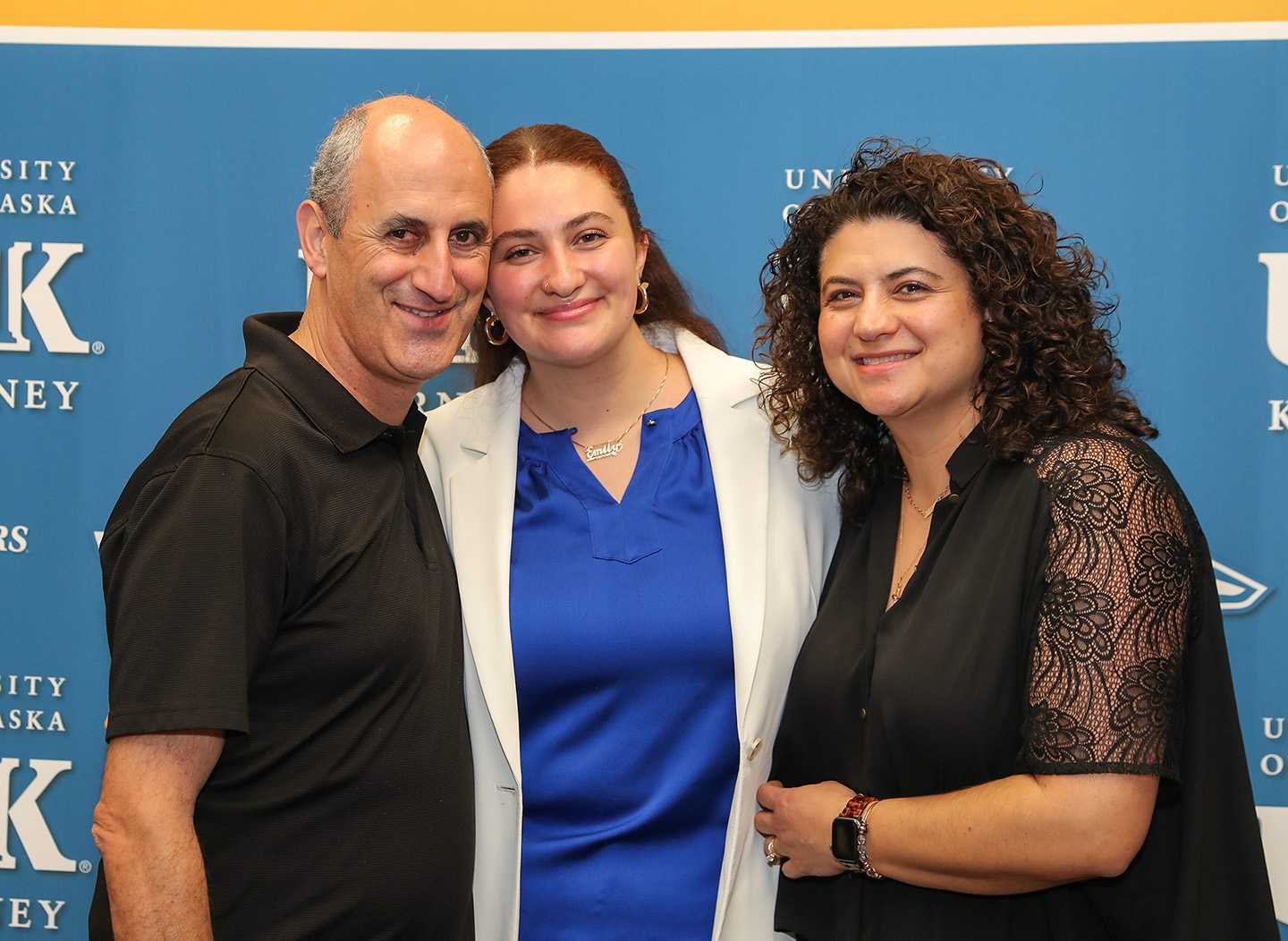 Emily Saadi poses for a photo with her parents, Camil and Nadia, during a UNK Student Government inauguration. Saadi served as student body president in 2022-23.