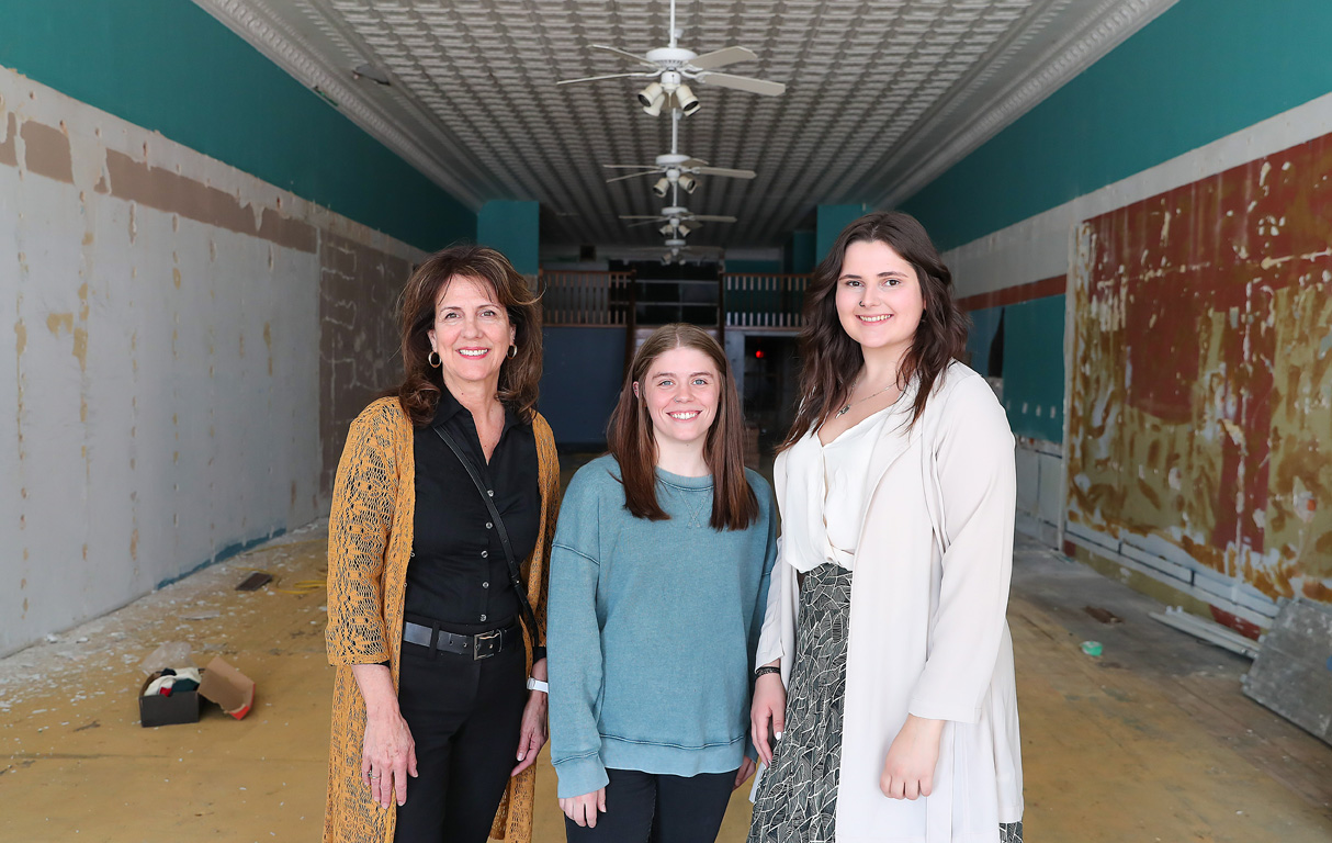 From left, associate professor Dana Vaux and UNK interior and product design students Sydney Thurlow and Steph Cassara are pictured inside the downtown Kearney building that served as the focus of their senior projects. (Photos by Erika Pritchard, UNK Communications)