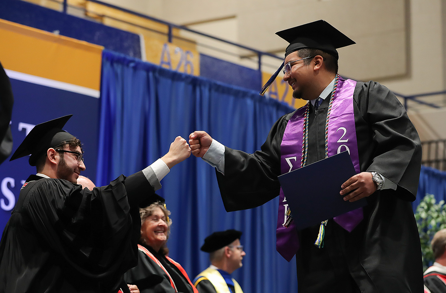 Jose Arredondo, right, graduated from UNK on Friday with a bachelor’s degree in language arts education. He’ll teach 7-12 English at Loup City Public Schools this fall. (Photos by Erika Pritchard, UNK Communications)