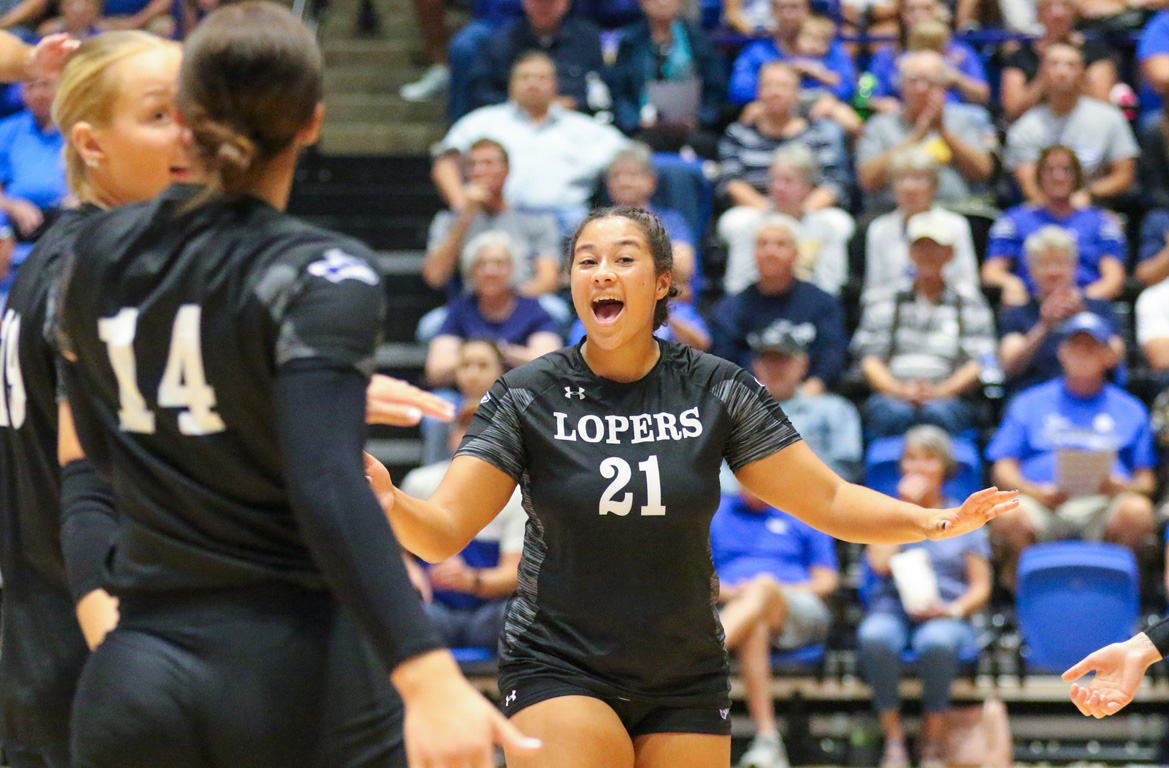 UNK outside hitter Jaden Ferguson (21) celebrates with her teammates during Wednesday night’s home match against Peru State College.