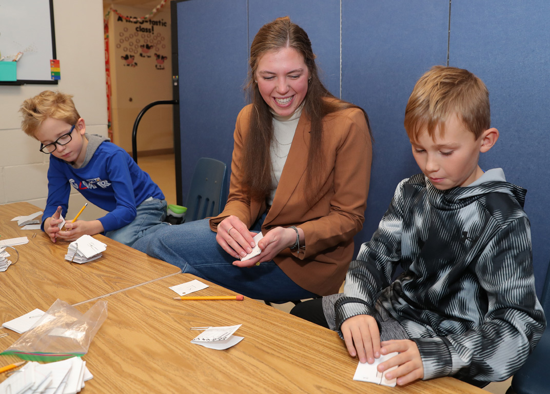 UNK sophomore Alyssa Fehringer leads a math activity for students at Meadowlark Elementary School in Kearney. Fehringer works as a tutor through the federal America Reads/America Counts program. (Photos by Erika Pritchard, UNK Communications)