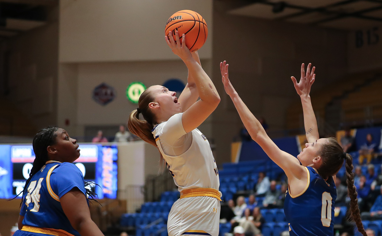 Shiloh McCool, center, is averaging a team-best 13.7 points and 9.1 rebounds per game for UNK.