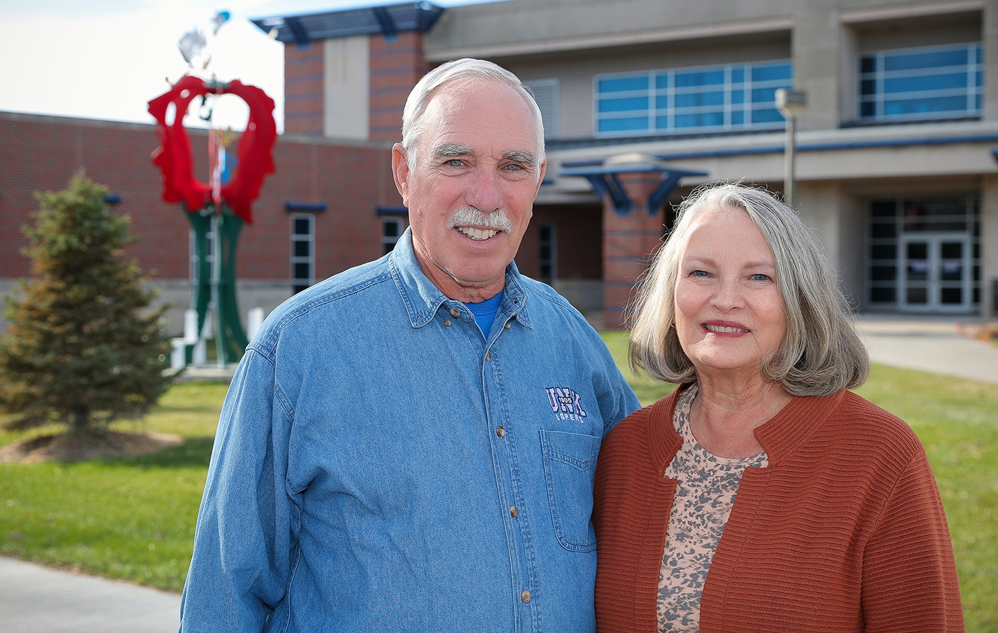 Steve and Kathy Godeken both graduated from Kearney State College in 1973 with teaching degrees. Proceeds from their “retirement auction” will benefit students at their alma mater. (Photo by Erika Pritchard, UNK Communications)