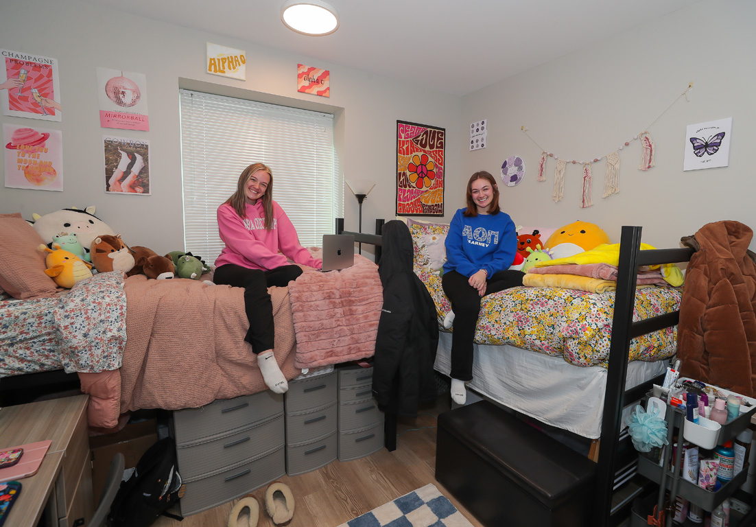 Alpha Omicron Pi members Lily White of Kearney, left, and Grace Maloley of Holdrege pose for a photo in their room inside Bess Furman Armstrong Hall. The new sorority housing opened earlier this month.