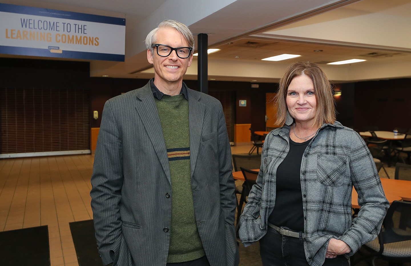 Patrick Hargon, director of the UNK Learning Commons, and student success coordinator Julie Everett pose for a photo at the office’s temporary location inside University Residence North. When the Calvin T. Ryan Library renovation is complete, the Learning Commons will be part of the new Loper Success Hub on the second floor.