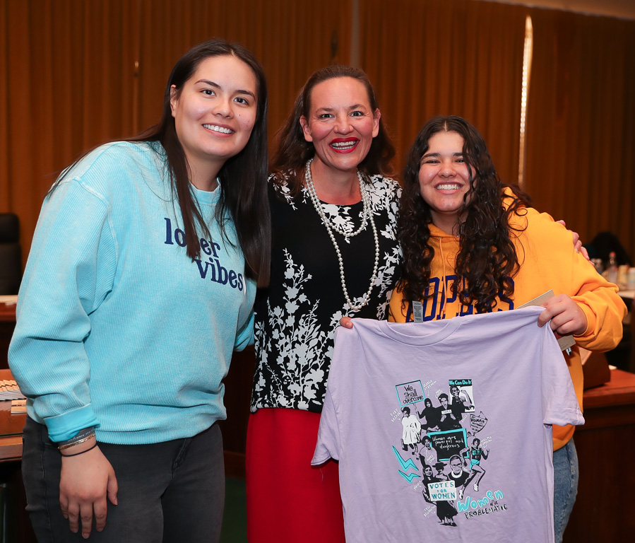 UNK students Laura Velasco, left, and Briana Marquez, right, pose for a photo with state Sen. Danielle Conrad during “I Love NU” Day at the State Capitol in Lincoln.