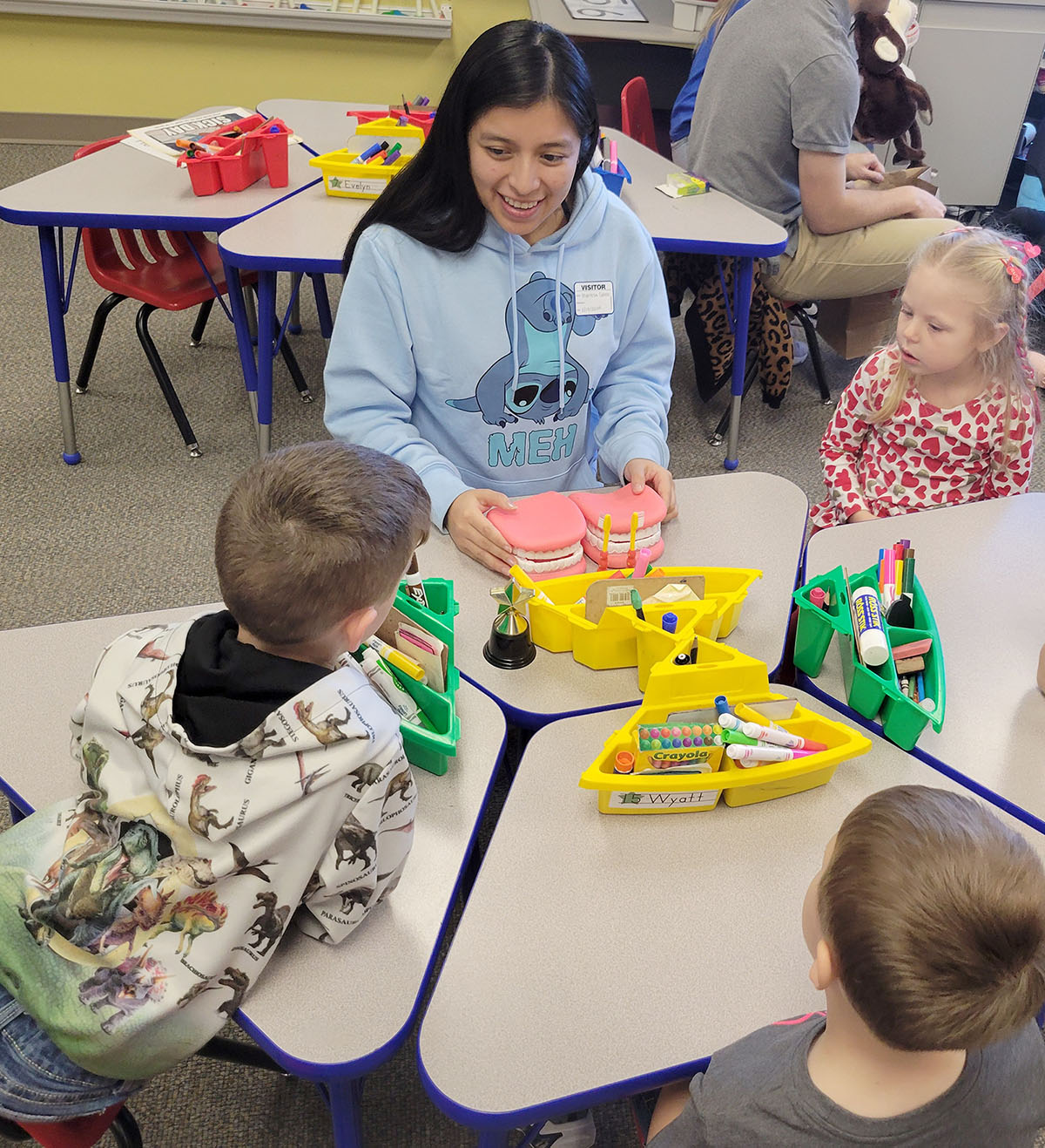 UNK senior Maritza Calmo Martin teaches Glenwood Elementary School kindergartners about oral health during a recent outreach event. Calmo Martin organizes these educational activities for local preschools and elementary schools. (UNK Health Sciences)