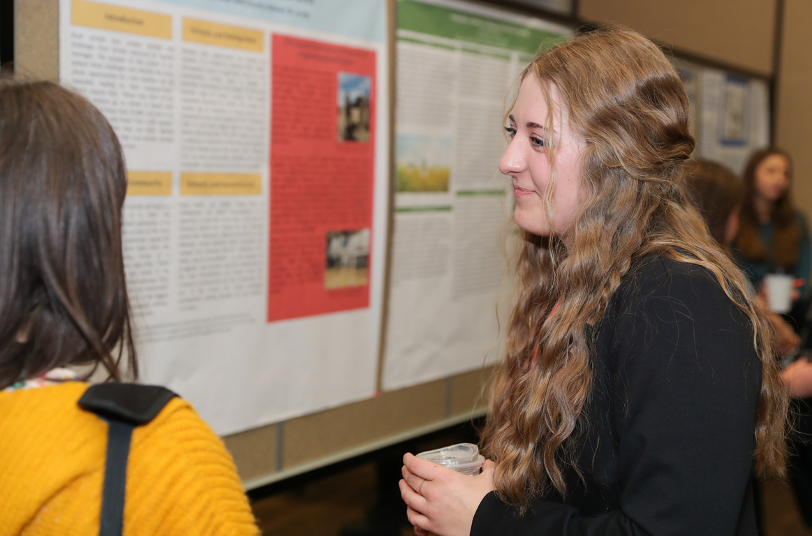 UNK freshman Juliana Merrihew shares her research on place-based education during Thursday’s Research Day celebration on campus.