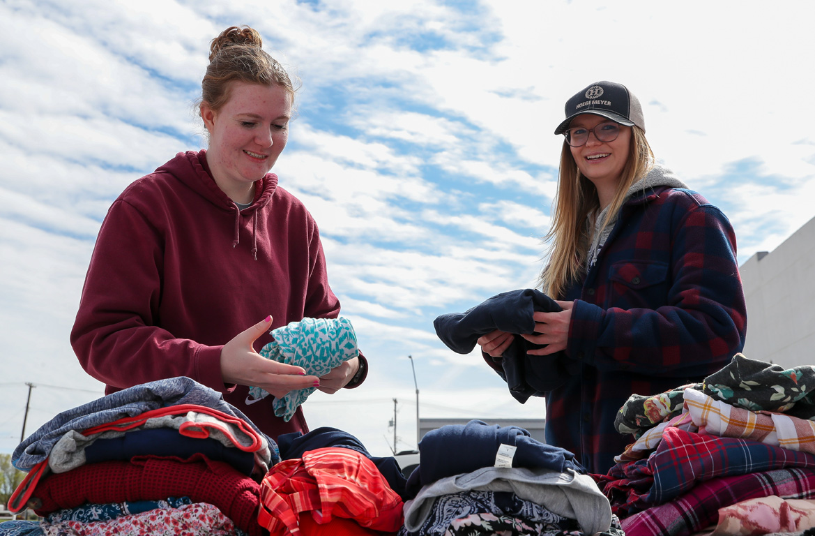 Kelcie Burke, left, Libby Yungdahl and other members of the UNK Graduate Student Association volunteered at the Kearney Jubilee Center on Saturday during The Big Event.