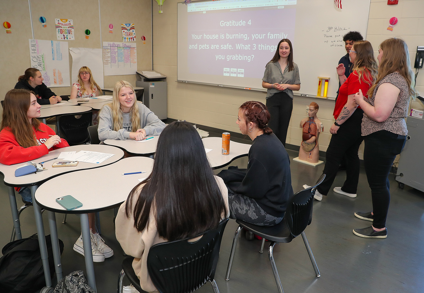 Members of the UNK social work student ambassador program discuss self-care strategies with Kearney High School students during a recent visit. (Photo by Erika Pritchard, UNK Communications)