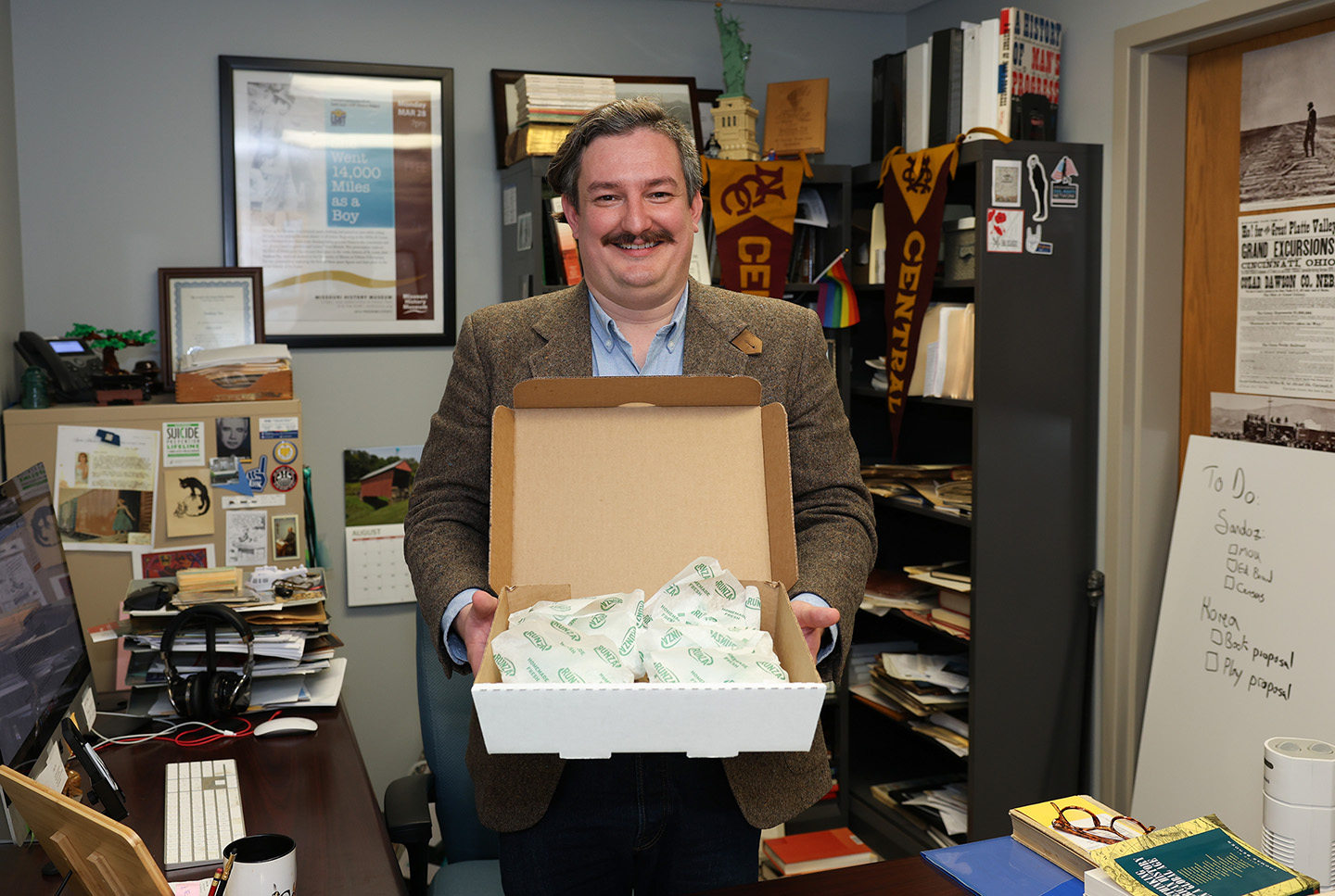 UNK associate history professor Nathan Tye brings Runzas for students in his Nebraska in the World class. The popular fast-food item is one of many examples he uses to teach them about the state’s global connections. (Photos by Erika Pritchard, UNK Communications)