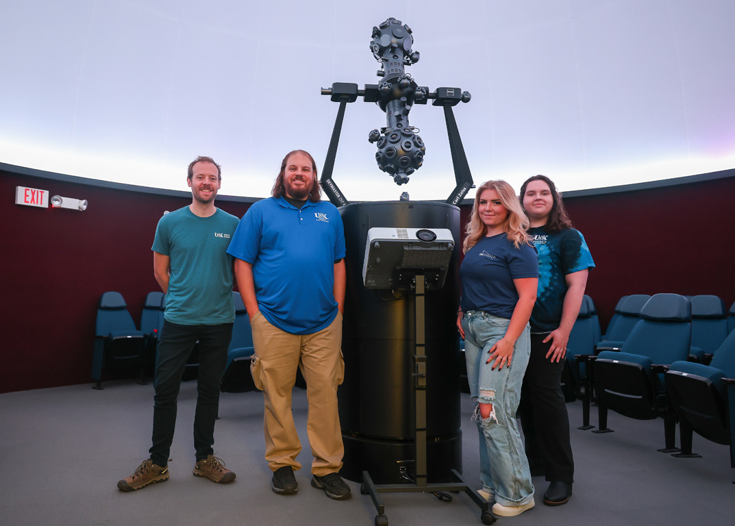 The UNK Astronomy Club utilizes the planetarium and other campus resources. From right, Kim Larbey and Barrett Lee started the student organization with support from faculty members like Adam Jensen and Brandon Marshall, the club’s adviser.