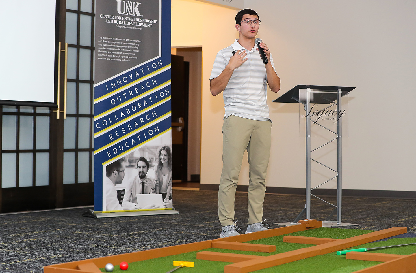 Zion Moyer pitches his portable miniature golf business during the last Big Idea Kearney competition.