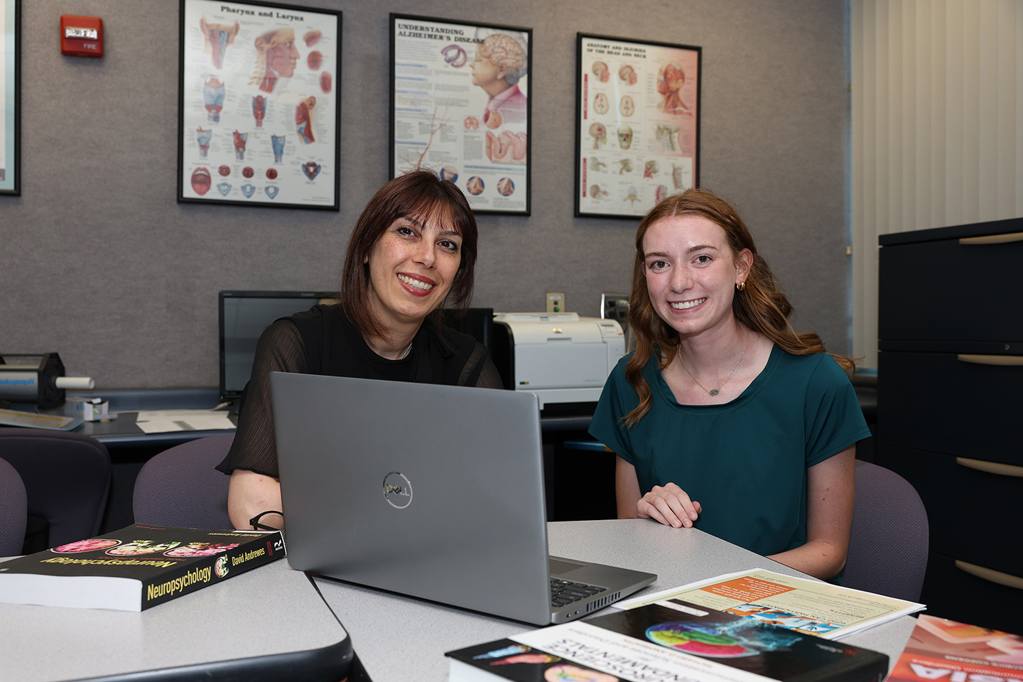 Associate professor of communication disorders Ladan Ghazi Saidi, left, and UNK junior Noelle Abels are part of a research project that focuses on identifying nonpharmaceutical interventions that can slow cognitive decline in older adults.