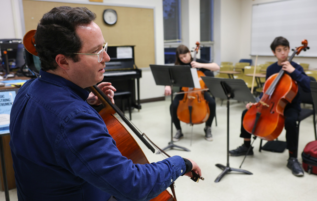 UNK music professor Noah Rogoff teaches students in the UNK String Project. He also serves as director of the program.