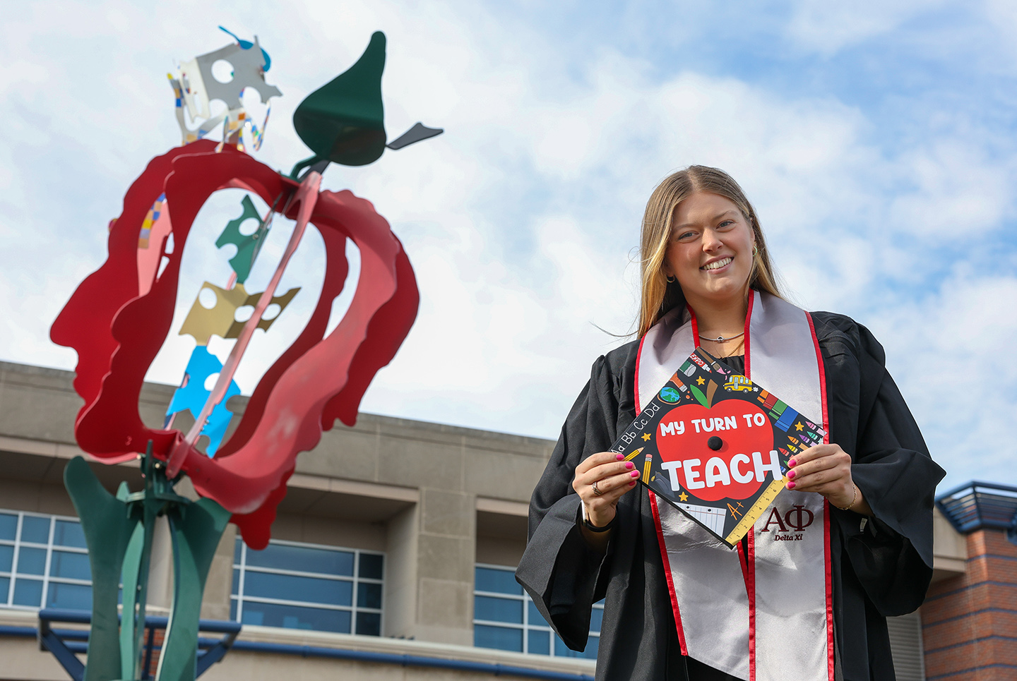 Mackenzie Coughlin graduates from UNK on Friday with a bachelor’s degree in elementary education. She’ll represent the College of Education as a gonfalonier during the commencement ceremony. (Photo by Erika Pritchard, UNK Communications)