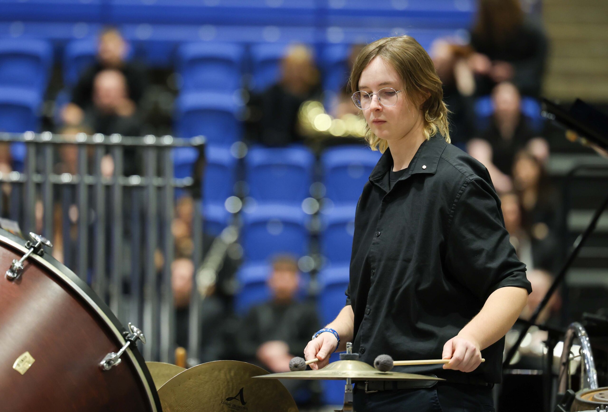 A girl plays the cymbals at a band concert at UNK.