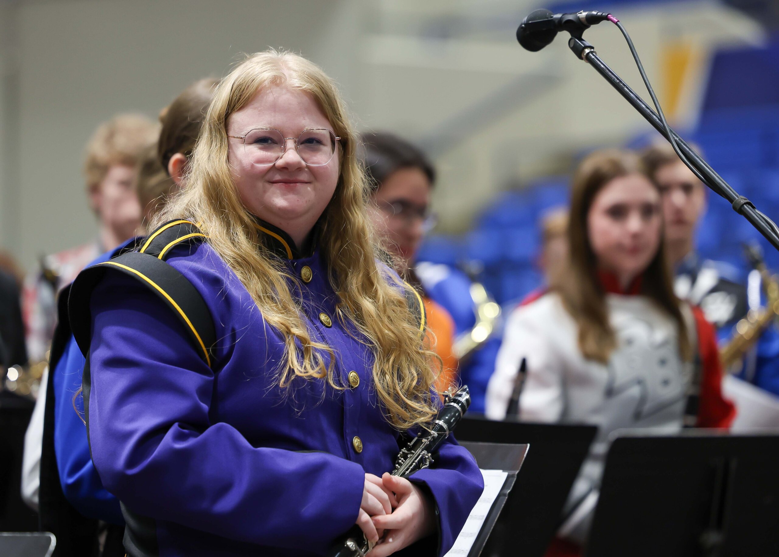 A high school band student smiles after performing at a concert at UNK.