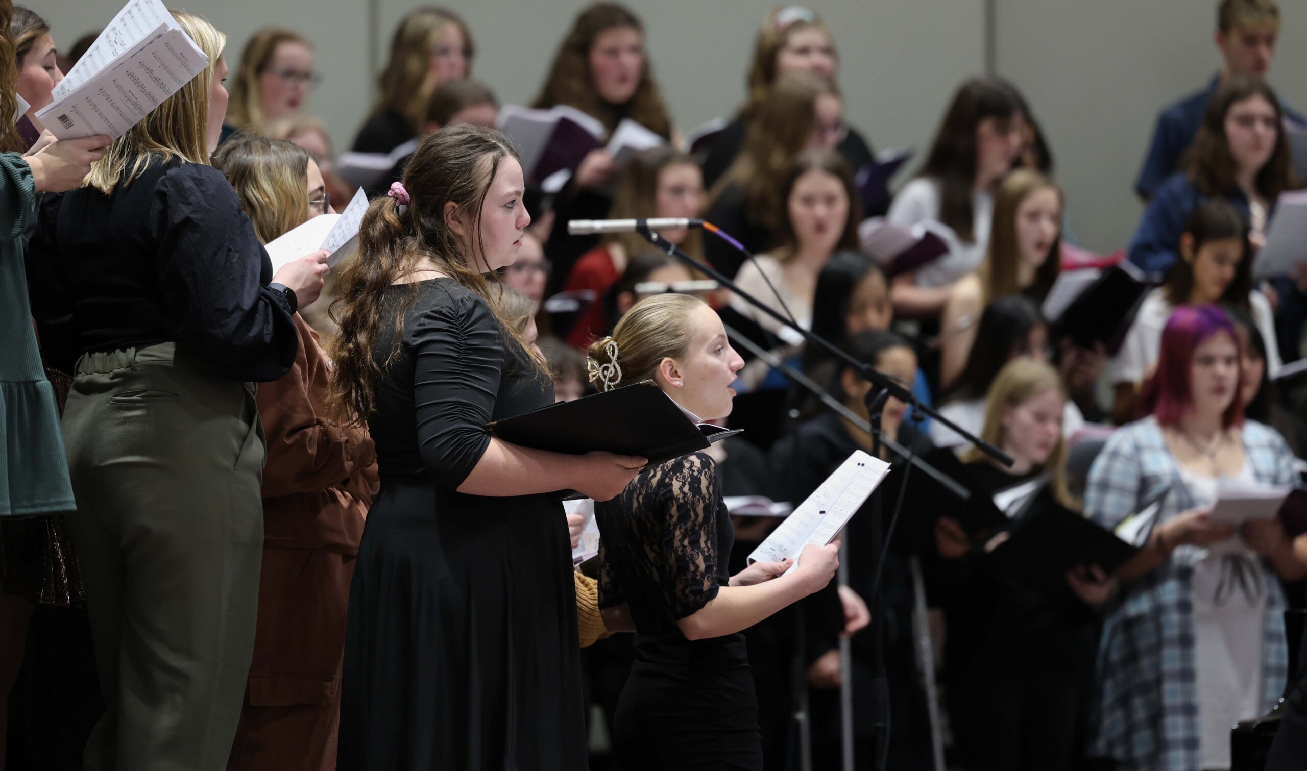 High school students sing at a choral concert at UNK.